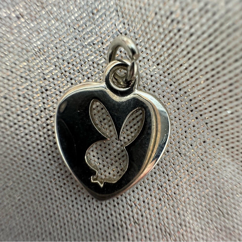 Playboy bunny necklace pendant silver hardware opening in middle heart rabbit